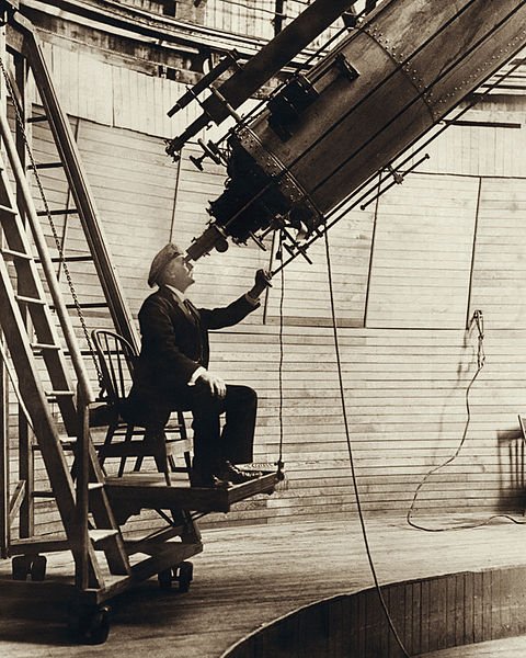 Lowell observing Venus in the Lowell Observatory, 1914.