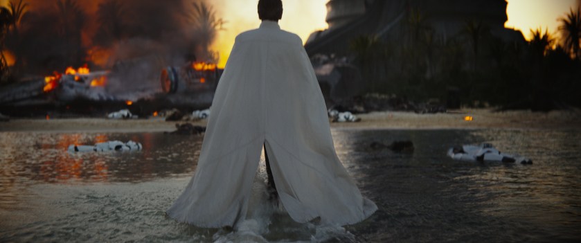 Director Orson Krennic strides across a shoreline in this still from the first trailer 